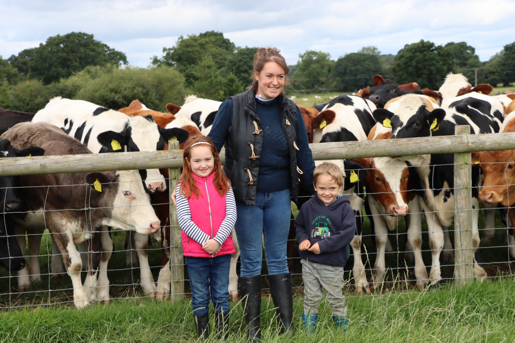 Genus ABS RMS customer, Hannah Potter, stood with her two children in front of herd.