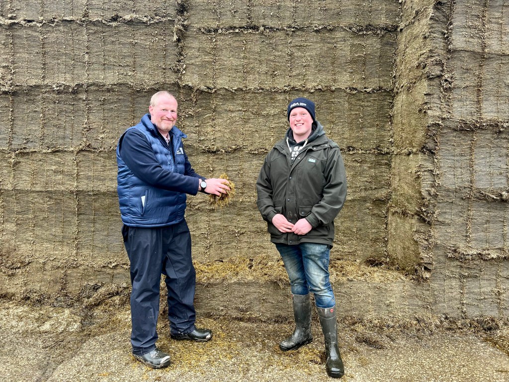 Harry Johnson and Chris Wood stood with silage clamp
